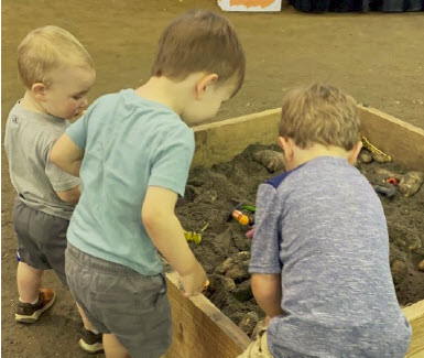 Children exploring in dirt.